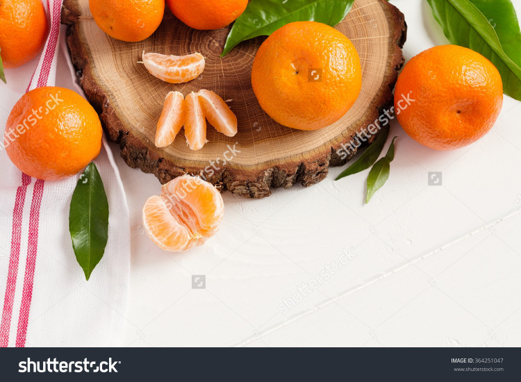mandarins on white wooden background